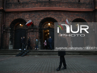 A miner participates in the traditional waking up of residents during Barborka in Nikiszowiec, Poland, on December 4, 2024. Barborka is a tr...