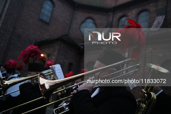 In Nikiszowiec, Poland, on December 4, 2024, the miners' orchestra walks through the streets of the city, traditionally waking up residents...