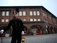 A miner with a lamp participates in the traditional waking up of residents during Barborka in Nikiszowiec, Poland, on December 4, 2024. Barb...