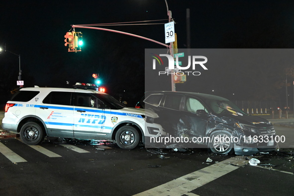 The NYPD investigates a collision involving an NYPD police cruiser and other vehicles during the pursuit of robbery suspects in the Laurelto...