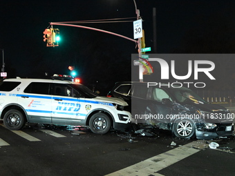 The NYPD investigates a collision involving an NYPD police cruiser and other vehicles during the pursuit of robbery suspects in the Laurelto...