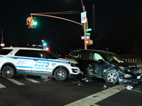 The NYPD investigates a collision involving an NYPD police cruiser and other vehicles during the pursuit of robbery suspects in the Laurelto...