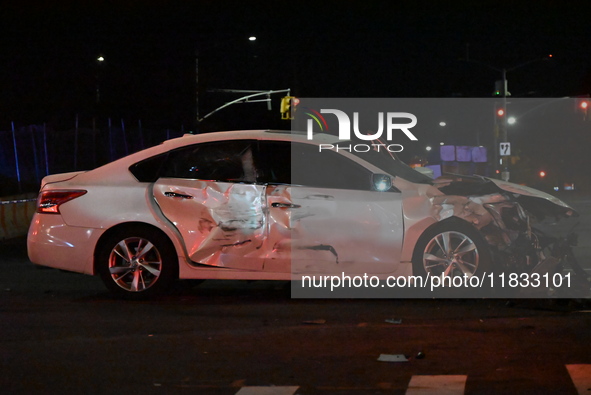 The NYPD investigates a collision involving an NYPD police cruiser and other vehicles during the pursuit of robbery suspects in the Laurelto...