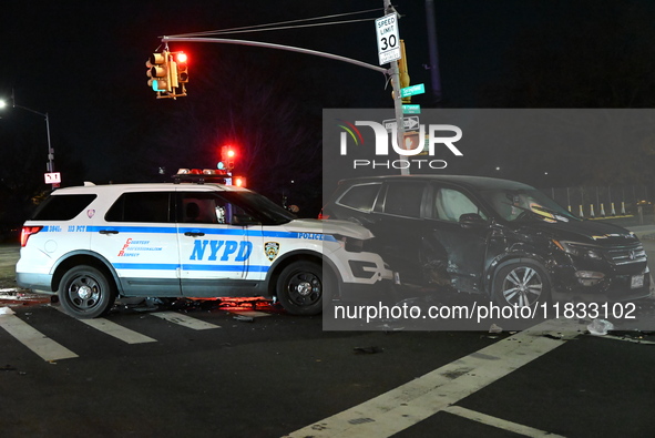 The NYPD investigates a collision involving an NYPD police cruiser and other vehicles during the pursuit of robbery suspects in the Laurelto...