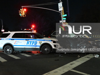 The NYPD investigates a collision involving an NYPD police cruiser and other vehicles during the pursuit of robbery suspects in the Laurelto...