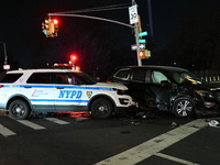 The NYPD investigates a collision involving an NYPD police cruiser and other vehicles during the pursuit of robbery suspects in the Laurelto...