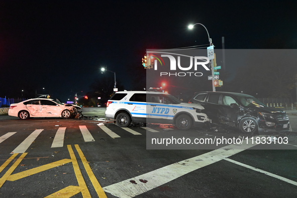 The NYPD investigates a collision involving an NYPD police cruiser and other vehicles during the pursuit of robbery suspects in the Laurelto...