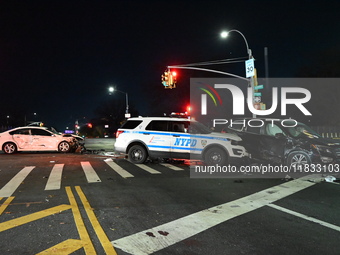 The NYPD investigates a collision involving an NYPD police cruiser and other vehicles during the pursuit of robbery suspects in the Laurelto...