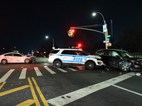 The NYPD investigates a collision involving an NYPD police cruiser and other vehicles during the pursuit of robbery suspects in the Laurelto...