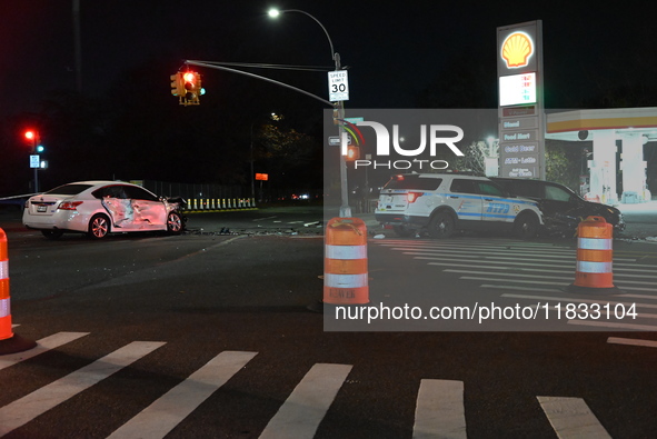 The NYPD investigates a collision involving an NYPD police cruiser and other vehicles during the pursuit of robbery suspects in the Laurelto...