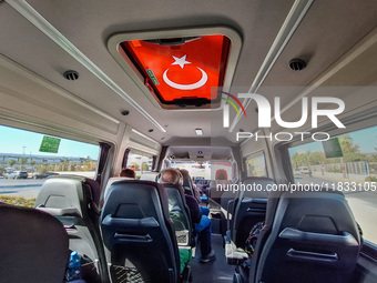 The Turkish flag on the sunroof of the bus is seen in Alanya, Antalya, Turkey, on November 2, 2024. (