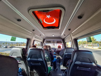 The Turkish flag on the sunroof of the bus is seen in Alanya, Antalya, Turkey, on November 2, 2024. (