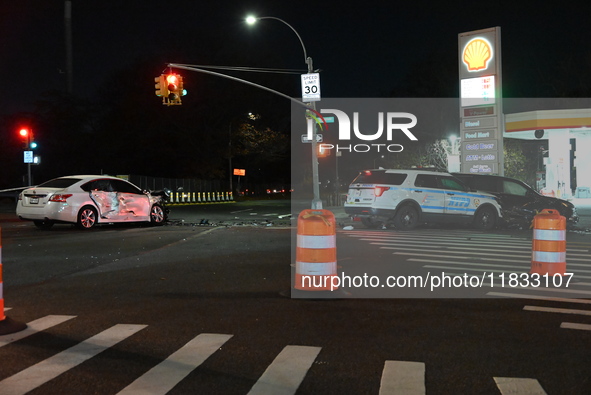 The NYPD investigates a collision involving an NYPD police cruiser and other vehicles during the pursuit of robbery suspects in the Laurelto...