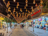 People visit a market with sellers of counterfeit clothes, shoes, and handbags in Alanya, Antalya, Turkey, on November 4, 2024 (