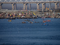 People take boat rides at Sangam, the confluence of the rivers Ganges, Yamuna, and Saraswati, in Prayagraj, India, on December 4, 2024. (