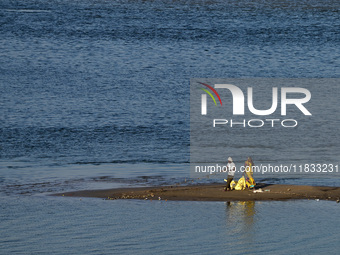 Workers clean the banks of Sangam, the confluence of the Rivers Ganges, Yamuna, and mythical Saraswati, ahead of the Maha Kumbh Mela festiva...