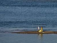 Workers clean the banks of Sangam, the confluence of the Rivers Ganges, Yamuna, and mythical Saraswati, ahead of the Maha Kumbh Mela festiva...