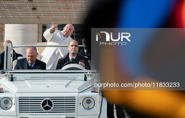 Pope Francis leaves after the weekly general audience in Saint Peter's Square, Vatican City, on December 4, 2024. 