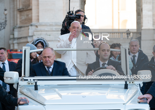 Pope Francis waves to pilgrims during the weekly general audience in St Peter's Square at the Vatican on December 4, 2024. 