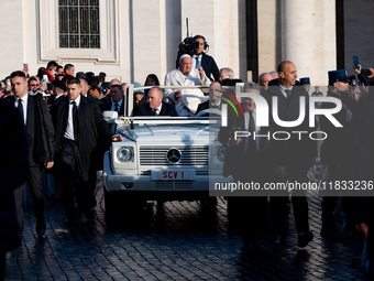 Pope Francis waves to pilgrims during the weekly general audience in St Peter's Square at the Vatican on December 4, 2024. (