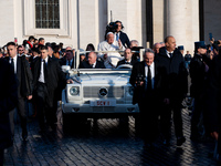 Pope Francis waves to pilgrims during the weekly general audience in St Peter's Square at the Vatican on December 4, 2024. (