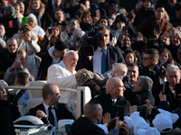 Pope Francis waves to pilgrims during the weekly general audience in St Peter's Square at the Vatican on December 4, 2024. (