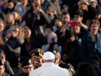 Pope Francis waves to pilgrims during the weekly general audience in St Peter's Square at the Vatican on December 4, 2024. (