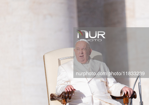 Pope Francis addresses a message to pilgrims during the weekly general audience in St. Peter's Square in Vatican City, on December 4, 2024. 