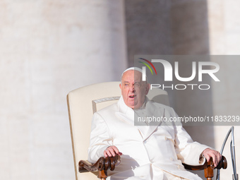 Pope Francis addresses a message to pilgrims during the weekly general audience in St. Peter's Square in Vatican City, on December 4, 2024....