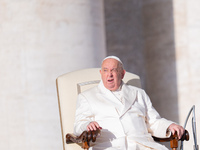 Pope Francis addresses a message to pilgrims during the weekly general audience in St. Peter's Square in Vatican City, on December 4, 2024....