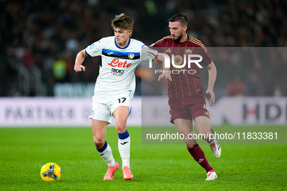 Charles De Ketelaere of Atalanta BC and Bryan Cristante of AS Roma compete for the ball during the Serie A Enilive match between AS Roma and...