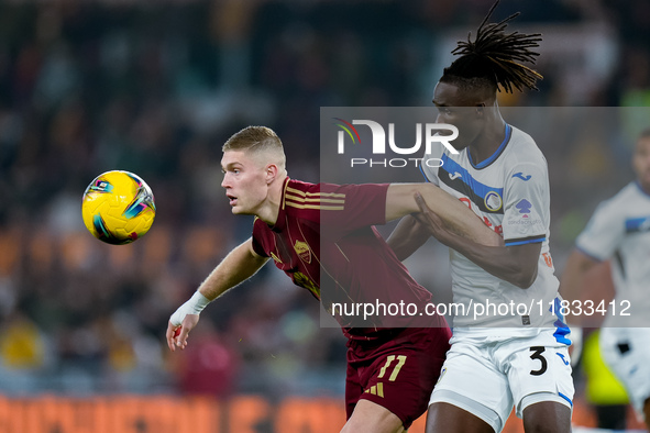 Odilon Kossounou of Atalanta BC and Artem Dovbyk of AS Roma compete for the ball during the Serie A Enilive match between AS Roma and Atalan...