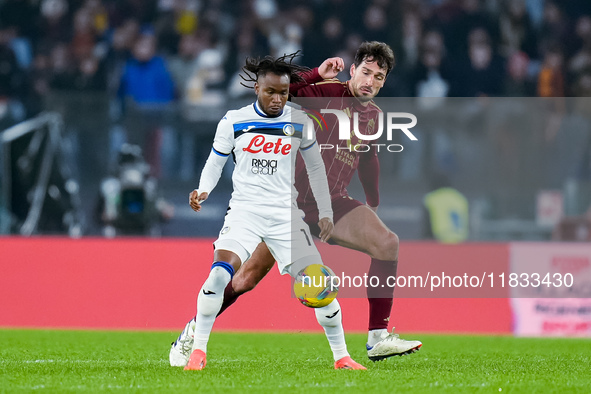 Ademola Lookman of Atalanta BC and Mats Hummels of AS Roma compete for the ball during the Serie A Enilive match between AS Roma and Atalant...