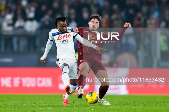 Ademola Lookman of Atalanta BC and Mats Hummels of AS Roma compete for the ball during the Serie A Enilive match between AS Roma and Atalant...