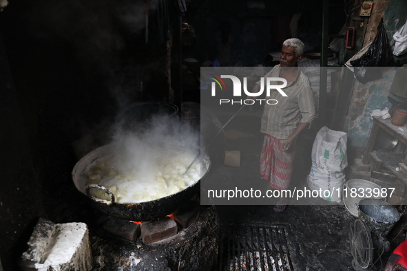 A worker prepares Indian sweet Petha inside a workshop in Kolkata, India, on December 4, 2024. 