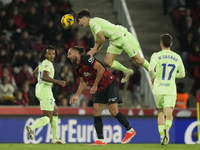 Pau Cubarsi centre-back of Barcelona and Spain and Vedat Muriqi centre-forward of Mallorca and Kosovo compete for the ball during the La Lig...