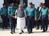 Police personnel escort detainee Amir Hossain Amu, former Minister and one of the top leaders of the Bangladesh Awami League party, to the I...