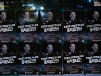 Posters featuring the face of President Yoon Suk-yeol superimposed onto the image of former military dictator Chun Doo-hwan are displayed at...