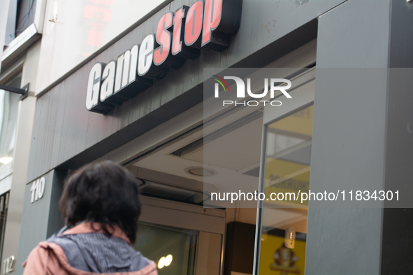 A general view of the GameStop retailer store logo in the city center of Cologne, Germany, as the game retailer plans to close all its store...