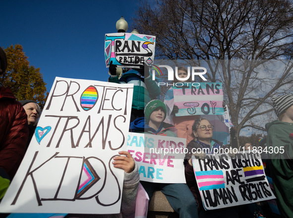 Children take part in a demonstration outside the Supreme Court as it hears a case on gender-affirming care for transgender children in Wash...