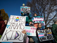 Children take part in a demonstration outside the Supreme Court as it hears a case on gender-affirming care for transgender children in Wash...