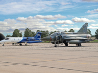 A Dassault Mirage 2000D of the French Air and Space Force and a Learjet 35A from Gesellschaft fur Flugzieldarstellung company are parked at...