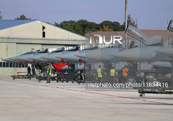 Various Eurofighter EF-2000 Typhoons are parked at Los Llanos military air base during the Tactical Leadership Programme in Albacete, Spain,...