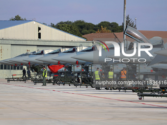 Various Eurofighter EF-2000 Typhoons are parked at Los Llanos military air base during the Tactical Leadership Programme in Albacete, Spain,...