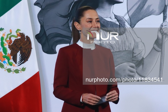 Mexico's President Claudia Sheinbaum speaks during a briefing conference to announce that, as of January 1, 2025, the minimum salary increas...