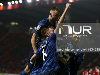 Max Anderson of Crawley Town celebrates his goal with teammates during the Sky Bet League 1 match between Charlton Athletic and Crawley Town...