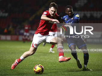 Josh Edwards of Charlton Athletic battles for the ball with Rushian Hepburn-Murphy of Crawley Town during the Sky Bet League 1 match between...