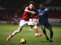 Josh Edwards of Charlton Athletic battles for the ball with Rushian Hepburn-Murphy of Crawley Town during the Sky Bet League 1 match between...