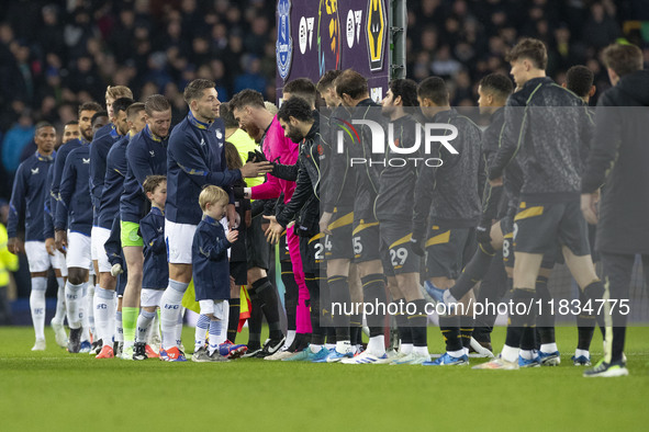 Players shake hands during the Premier League match between Everton and Wolverhampton Wanderers at Goodison Park in Liverpool, England, on D...