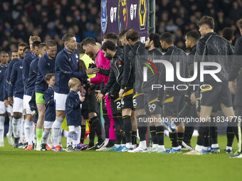 Players shake hands during the Premier League match between Everton and Wolverhampton Wanderers at Goodison Park in Liverpool, England, on D...